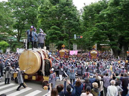 a large crowd of people watching a parade with a drum at Hotel Continental Fuchu in Fuchu