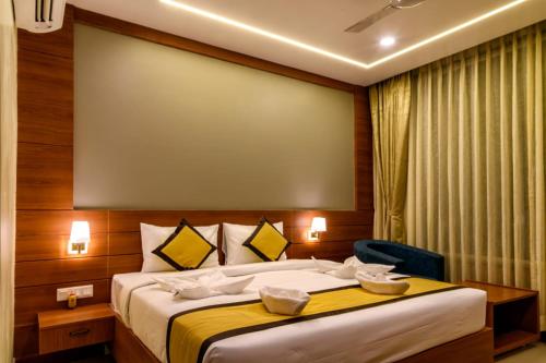 Ένα ή περισσότερα κρεβάτια σε δωμάτιο στο RS Regal Inn-Deoghar