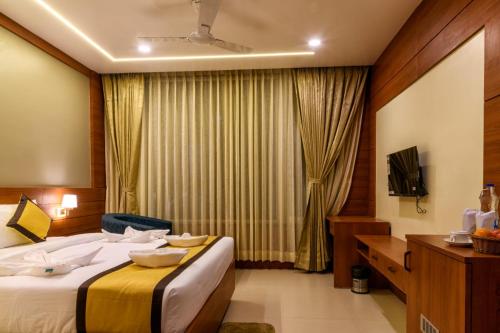 Ένα ή περισσότερα κρεβάτια σε δωμάτιο στο RS Regal Inn-Deoghar