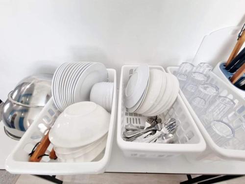 a white tray with dishes and utensils in a refrigerator at พูลวิลล่าบางแสน 3ห้องนอน 4ห้องน้ำ in Ban Laem Thaen