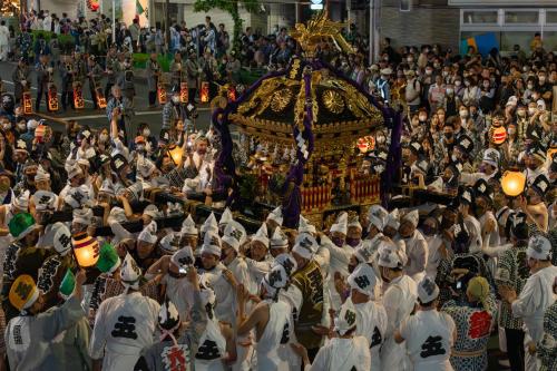 a group of people in white costumes in a parade at Hotel Continental Fuchu in Fuchu