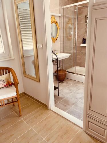 a bathroom with a shower and a glass door at Trogir Padre Dante FREE PARKING and STARLINK High speed internet in Trogir