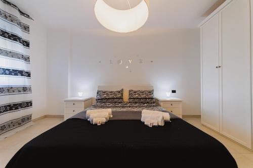 Ένα ή περισσότερα κρεβάτια σε δωμάτιο στο Swamyhome Aereoportobaripalese