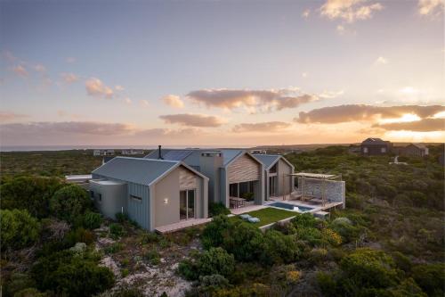 an aerial view of a house in the desert at Romansbaai Collection in Gansbaai