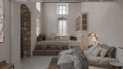 a living room with a couch and a table at Aelia mini villa in Lindos