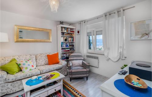 a living room with a couch and a table at Lovely Apartment In Rijeka With Wifi in Rijeka
