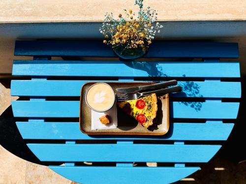 a plate of food on a blue table at 248 Boutique Studios, Sliema in Sliema