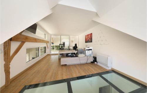 an office with a glass floor in a building at Le Loft De La Grange in Léglantiers