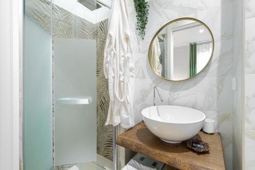 a bathroom with a white sink and a mirror at Casa SecondoTelli in Turin