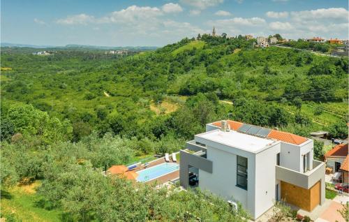 an aerial view of a house with a swimming pool at Villa Primavera in Buje