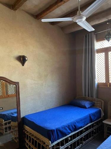 Katil atau katil-katil dalam bilik di Ecolodge El Beit
