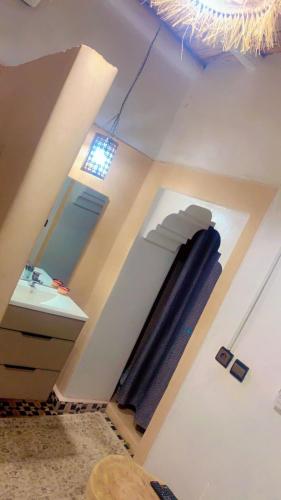 a bathroom with a sink and a mirror at Maison ALPHEA SPA HAMMAM in Marrakech
