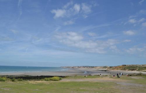 a group of people on a beach near the ocean at Holiday Home Maninghem Gh-1060 in Maninghem