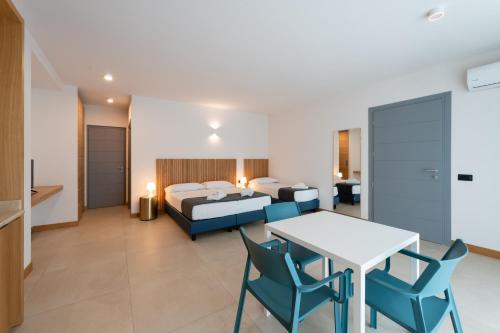 Ένα ή περισσότερα κρεβάτια σε δωμάτιο στο Hotel Delfino
