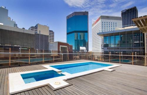 a swimming pool on the roof of a building at Cliveden on Bridge in Sydney