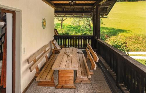 a porch with a wooden bench on a balcony at Ferienwohnung Klein St Paul in Eberstein