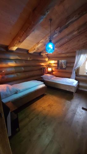 Postel nebo postele na pokoji v ubytování Holztraum Chalet mit Sauna