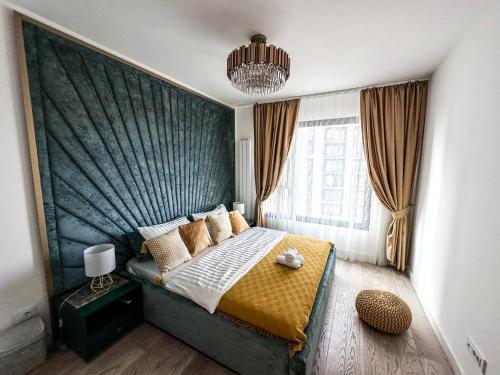 a bedroom with a bed and a large window at Beldorado Apartments - Belgrade Waterfront Luxury Emerald Apartment 60m2 in Belgrade