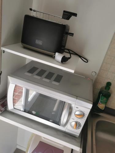 Apartment in Chiavennaにあるキッチンまたは簡易キッチン