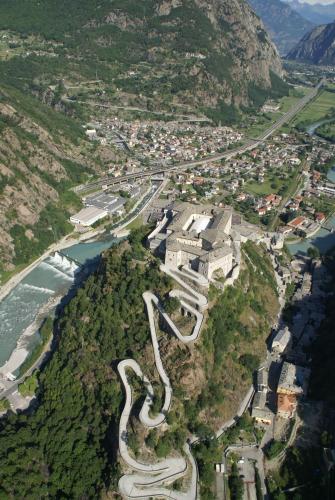 an aerial view of a winding road on a mountain at Hotel Ad Gallias in Bard