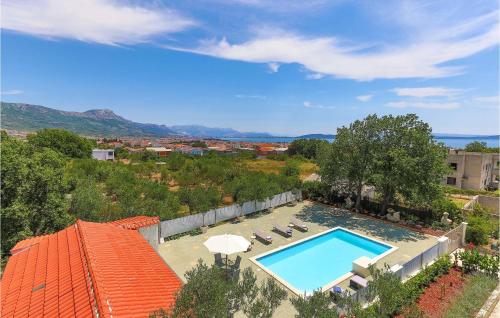 an aerial view of a house with a swimming pool at Cozy Apartment In Kastel Novi in Kastel Novi