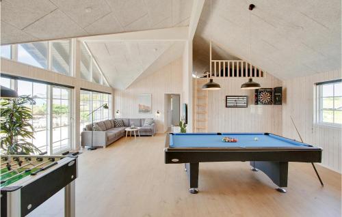 a living room with a pool table and a couch at Pet Friendly Home In Henne With Sauna in Henne Strand