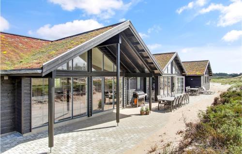 an extension to a house with a roof at Pet Friendly Home In Henne With Sauna in Henne Strand