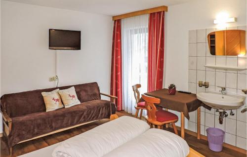 a living room with a couch and a sink at Charmante Ferienwohnung Kappl in Kappl