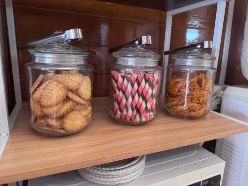 three jars of food on a shelf in a refrigerator at Your Place Inn in Karon Beach