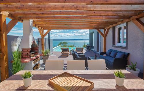 a living room with a blue couch and a table at Villa Amy in Zadar