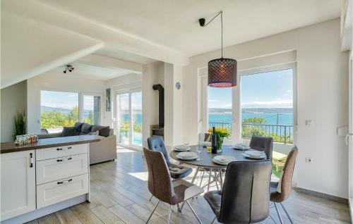 a kitchen and dining room with a table and chairs at Villa Amy in Zadar