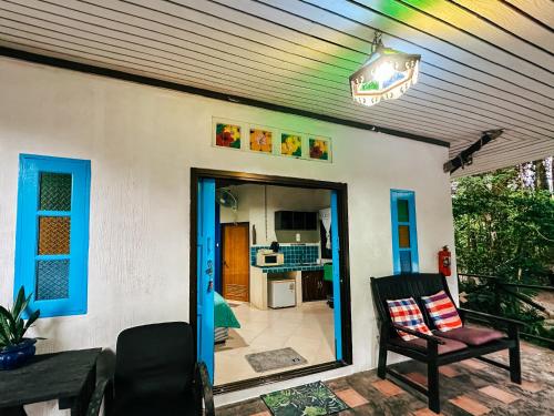 a house with a door open to a patio with a chair at Baan Suanthip Homestay - Aoluek Natural Retreat in Ao Luk