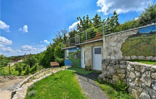 a stone house with a stone wall at 3 Bedroom Pet Friendly Home In Ludbreg in Ludbreg