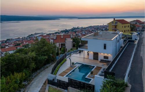 an aerial view of a house with a swimming pool at Stunning Home In Crikvenica in Crikvenica