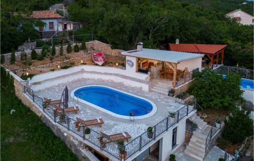 an aerial view of a house with a swimming pool at Villa Ancora in Jadranovo