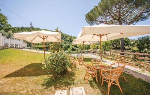 a group of tables and chairs under umbrellas at Villa Don Agostino in Vallo della Lucania