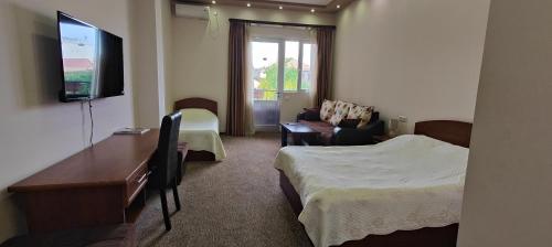 TV a/nebo společenská místnost v ubytování Areg Hotel