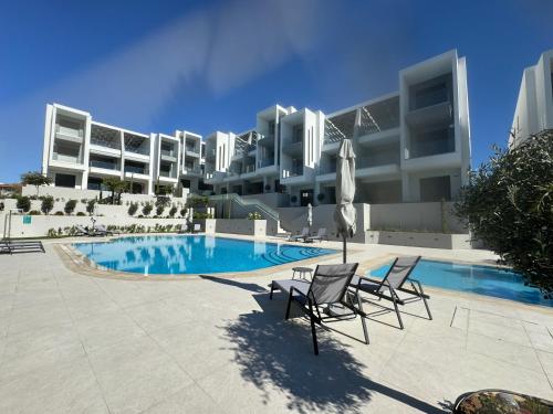 Swimmingpoolen hos eller tæt på Artion Cozy Residence Nikiti