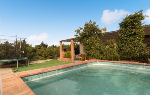 a swimming pool in the backyard of a house at Lovely Home In Almayate With Wi-Fi in Almayate Alto