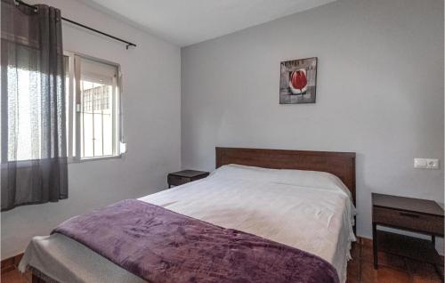 a bedroom with a bed and a window at Lovely Home In Almayate With Wi-Fi in Almayate Alto