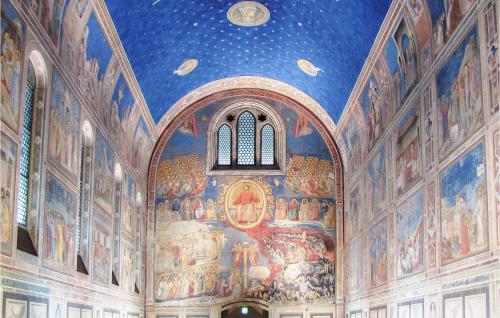 a large room with paintings on the walls at 2 Bedroom Gorgeous Home In Vò Euganeo in Boccon