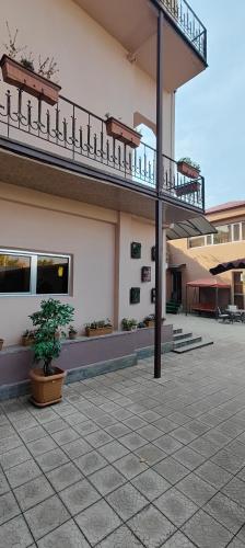 a building with a staircase on the side of it at Areg Hotel in Yerevan