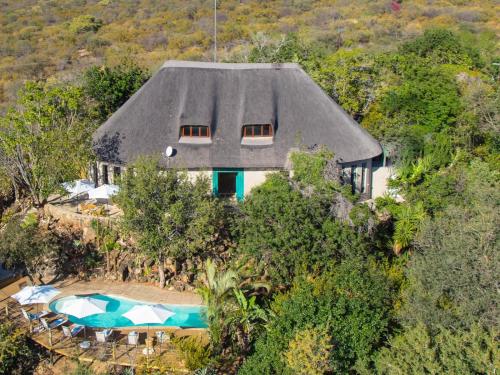 an aerial view of a house with a swimming pool at The Wild Blue Lodge SAFARI & SPA in Hoedspruit