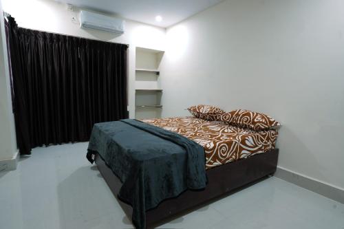 Postel nebo postele na pokoji v ubytování Sandeep Serviced Apartments