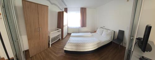 a small room with a bed and a window at Apartment, 3375 Krummnußbaum an der Donau in Krumnussbaum an der Donauuferbahn