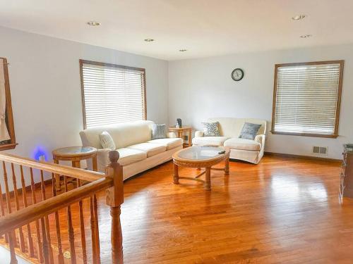 a living room with a couch and two chairs at 2000 square feet of comfort and relaxation near NYC in South River