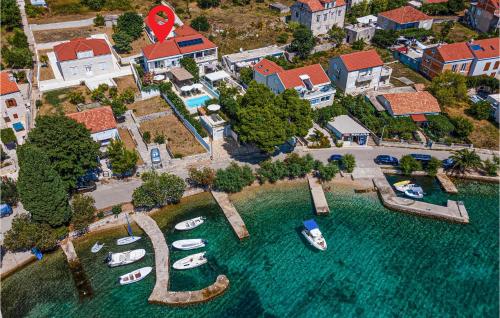 an aerial view of a resort with boats in the water at Stunning Home In Viganj in Viganj