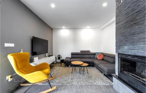 a living room with a couch and a fireplace at Stunning Home In Krusevo in Kruševo