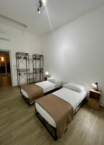 Ένα ή περισσότερα κρεβάτια σε δωμάτιο στο Cristina Home