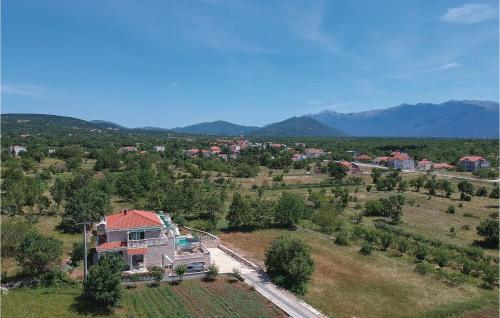 an aerial view of a house in a field at Nice Home In Zrnovnica-Split With Sauna in Cista Provo